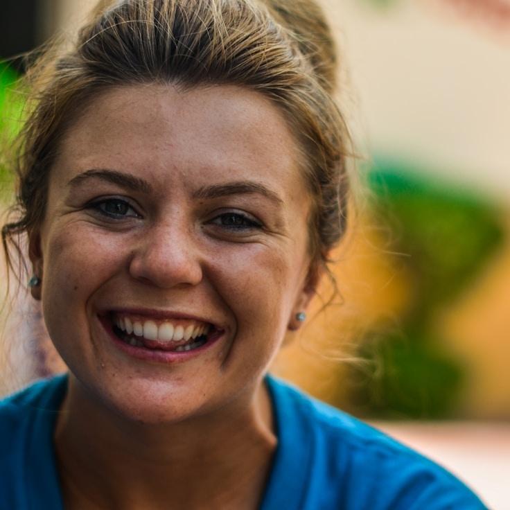 Kaveri Mehta, Lead Design Curator at BreezePaperField, reviewing corporate floral arrangements